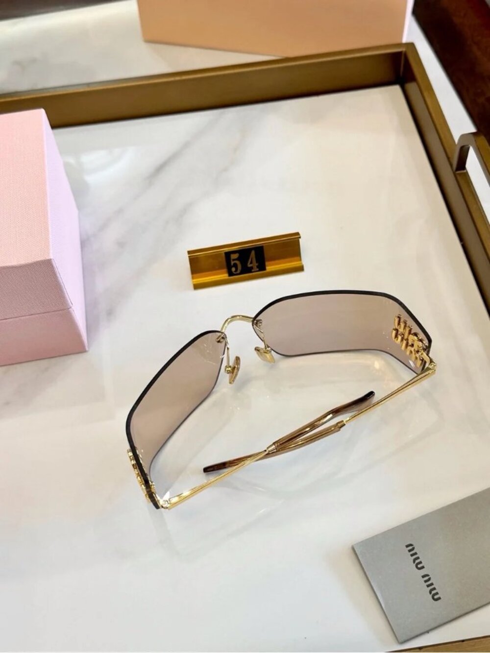 Miu Miu Rimless Sunglasses with Pink-Brown Lenses and Gold Accents - Picture 7 of 7